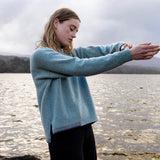 Crew neck sweater with blanket stitch detailing – Seastone and Grey - Fisherman Out of Ireland - on model, side