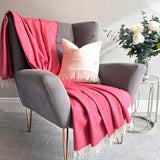 Merino Lambswool Throw - Red and Cream Herringbone - McNutt of Donegal - on armchair