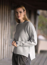 Crew neck sweater with blanket stitch detailing – Cloud and Indigo - Fisherman Out of Ireland - on model, side