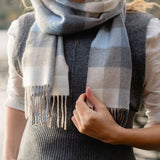 Fine Merino Scarf - Blue, Grey, Stone and White Block Check - John Hanly - on model, close up