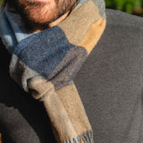 Lambswool Scarf - Beige, Grey, Blue, Silver and Navy Block Check - John Hanly - on model, close up