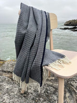 Merino lambswool Ripple Throw - Navy - McNutt - on chair